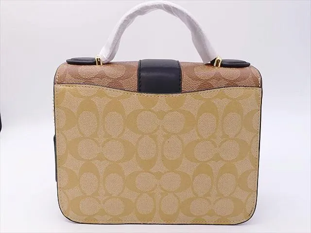 C.O.A.C.H. Small Georgie Top Handle In Blocked Signature Canvas Bag