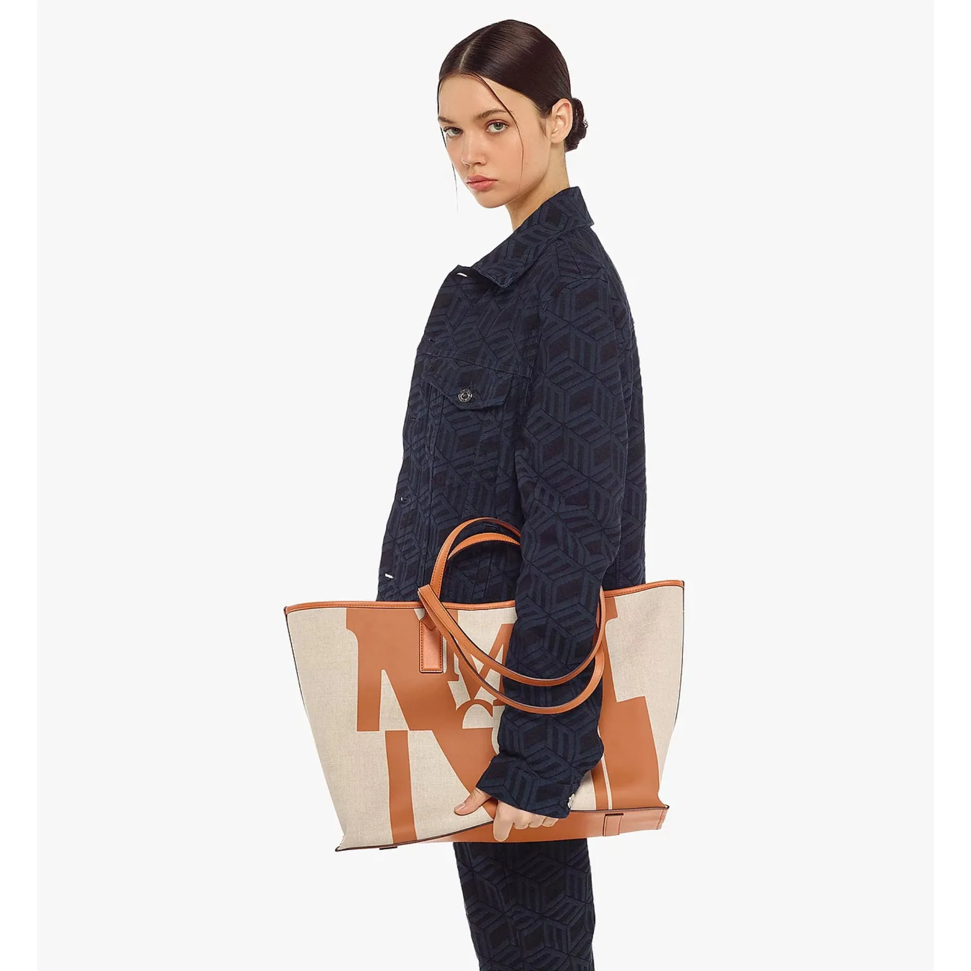 MCM pushes the architectural logo to its limit, causing a deep glitch in the classic